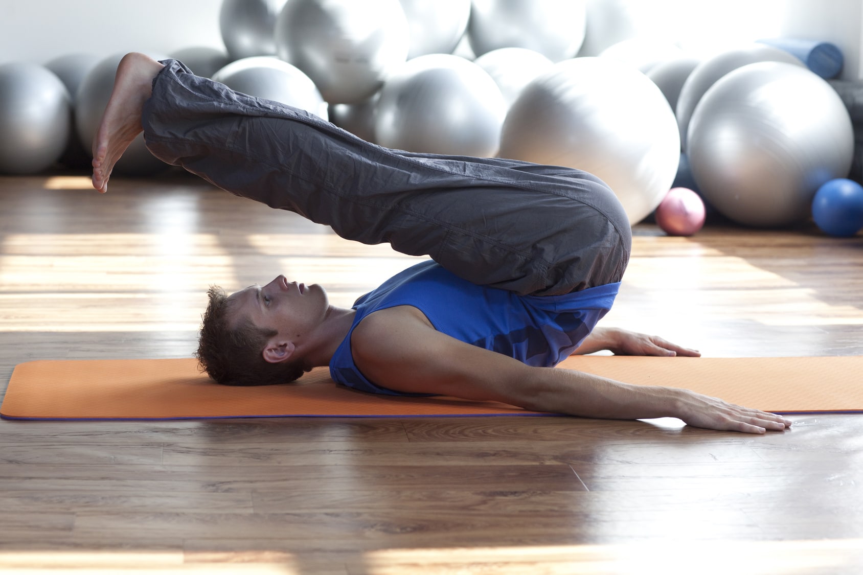 mind, body control - man practicing pilates